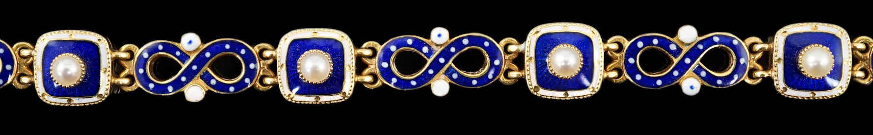 An early 20th century gold (tests as 18ct), two colour enamel and spilt pearl set bracelet